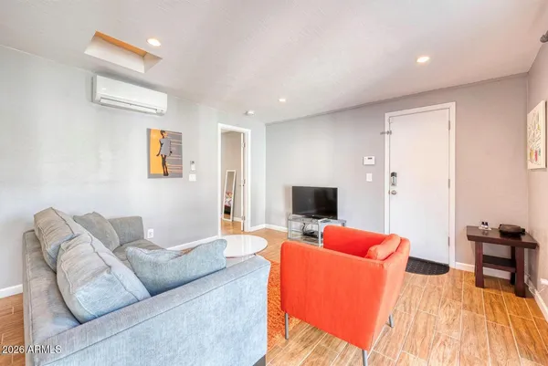 a living room with furniture and a large window