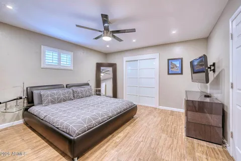 a living room with furniture and a view of kitchen