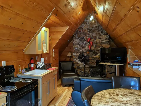 a kitchen with stainless steel appliances granite countertop a stove and a wooden cabinets