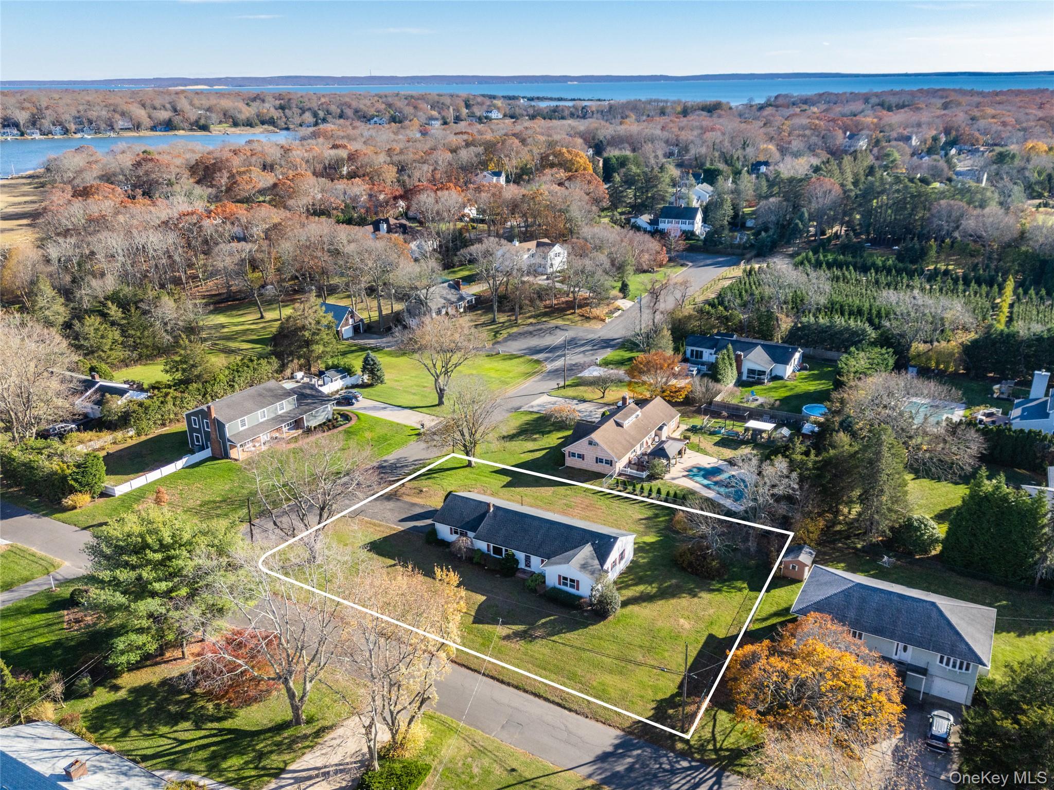 280 Clearview Avenue Southold, NY 11971 - Photo 30 of 41 Aerial perspective of suburban area featuring a large body of water and property parcel outlined
