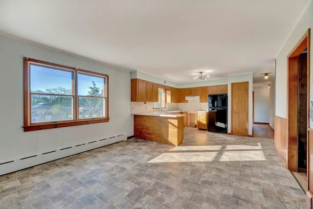 a view of a kitchen with a sink and a window
