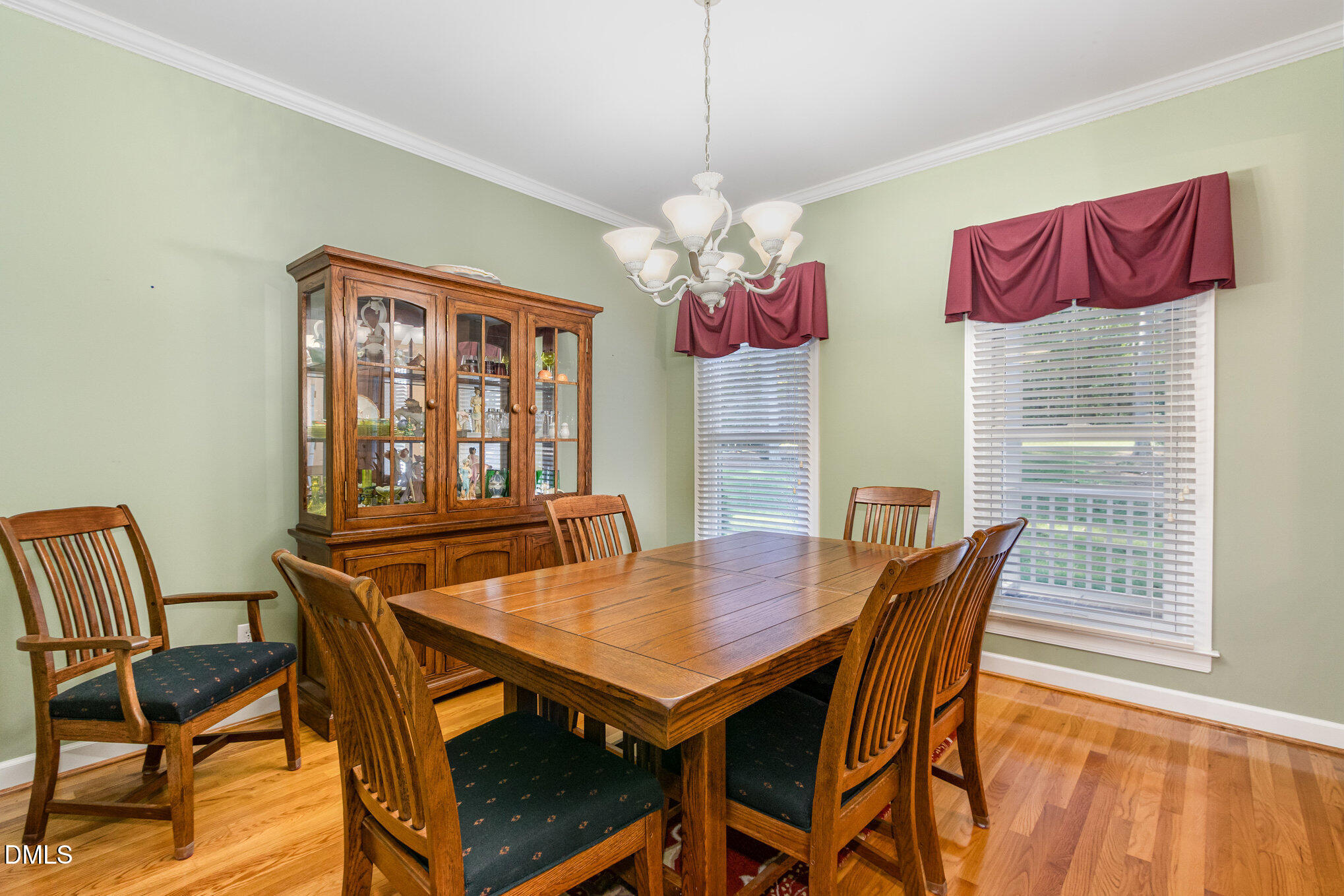 6018 West Tom Parham Road Oxford, NC 27565 - Photo 13 of 36 a view of a dining room with furniture and wooden floor