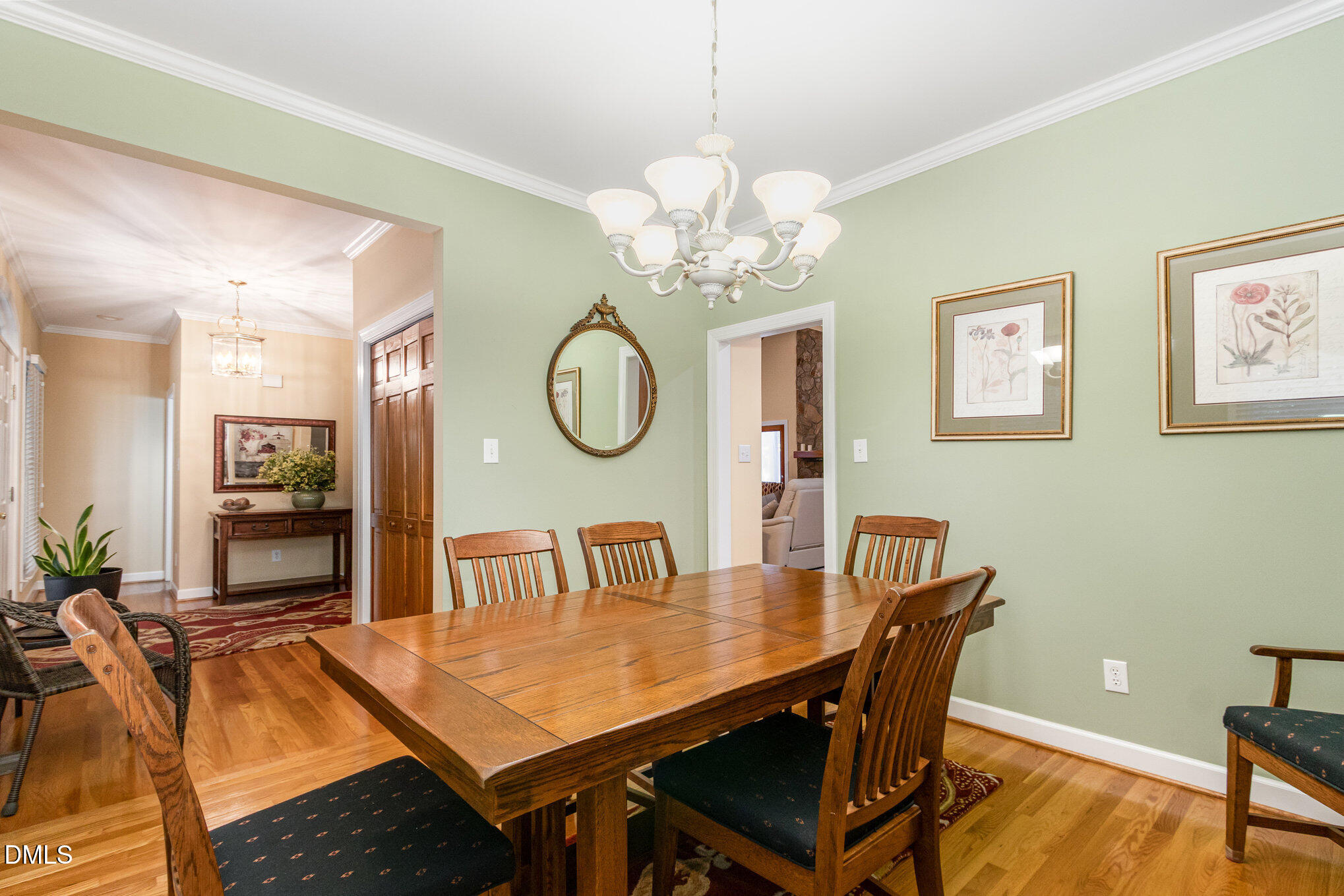 6018 West Tom Parham Road Oxford, NC 27565 - Photo 14 of 36 a view of a dining room with furniture and wooden floor