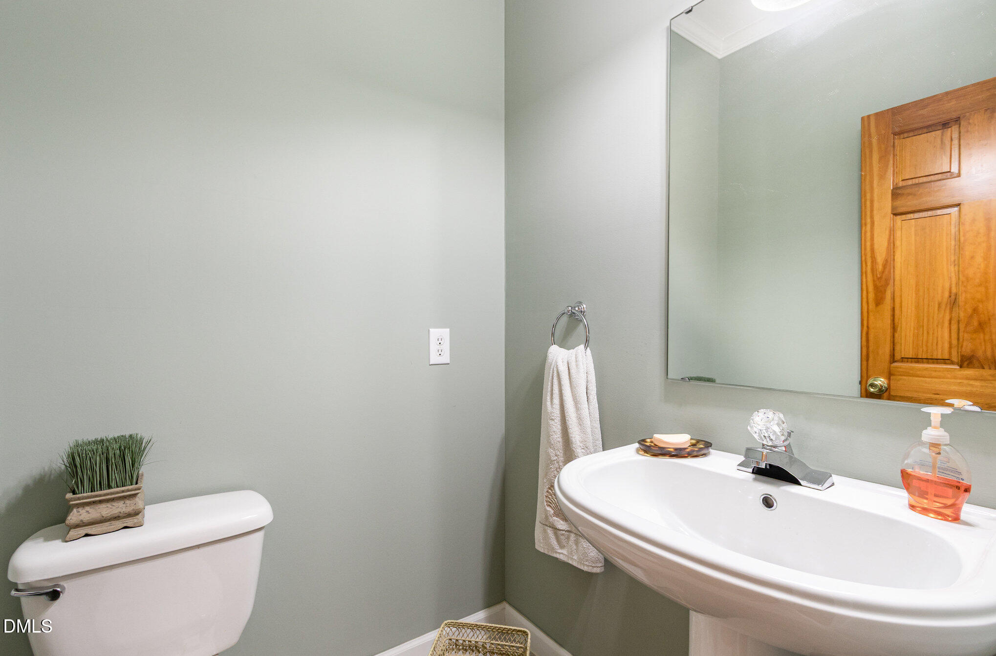 6018 West Tom Parham Road Oxford, NC 27565 - Photo 15 of 36 a bathroom with a sink a toilet and a mirror