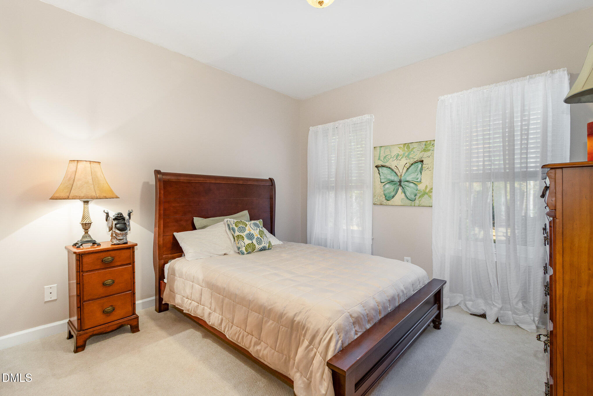 6018 West Tom Parham Road Oxford, NC 27565 - Photo 19 of 36 a bedroom with a bed and a window