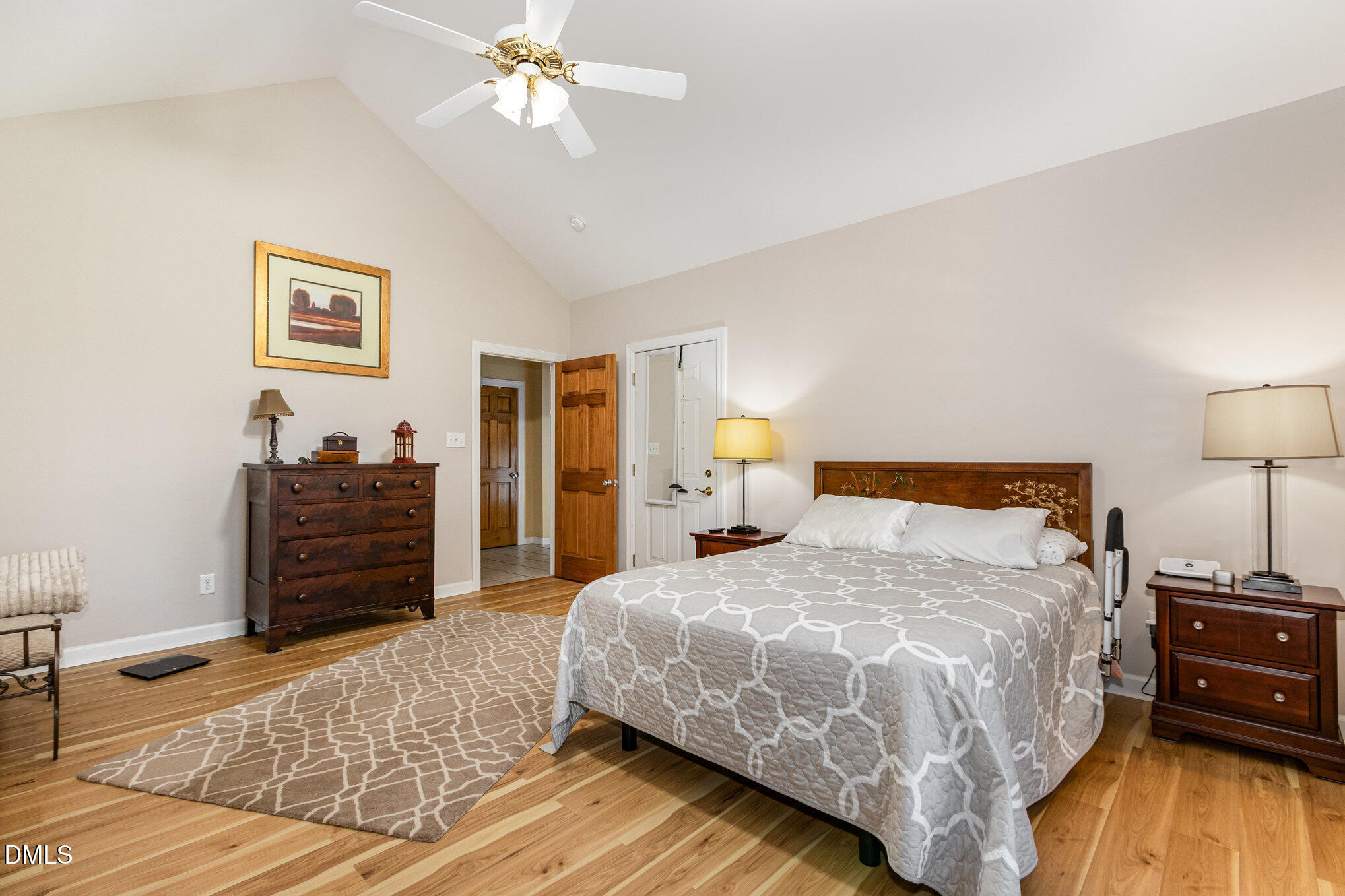 6018 West Tom Parham Road Oxford, NC 27565 - Photo 20 of 36 a bedroom with a bed and wooden floor