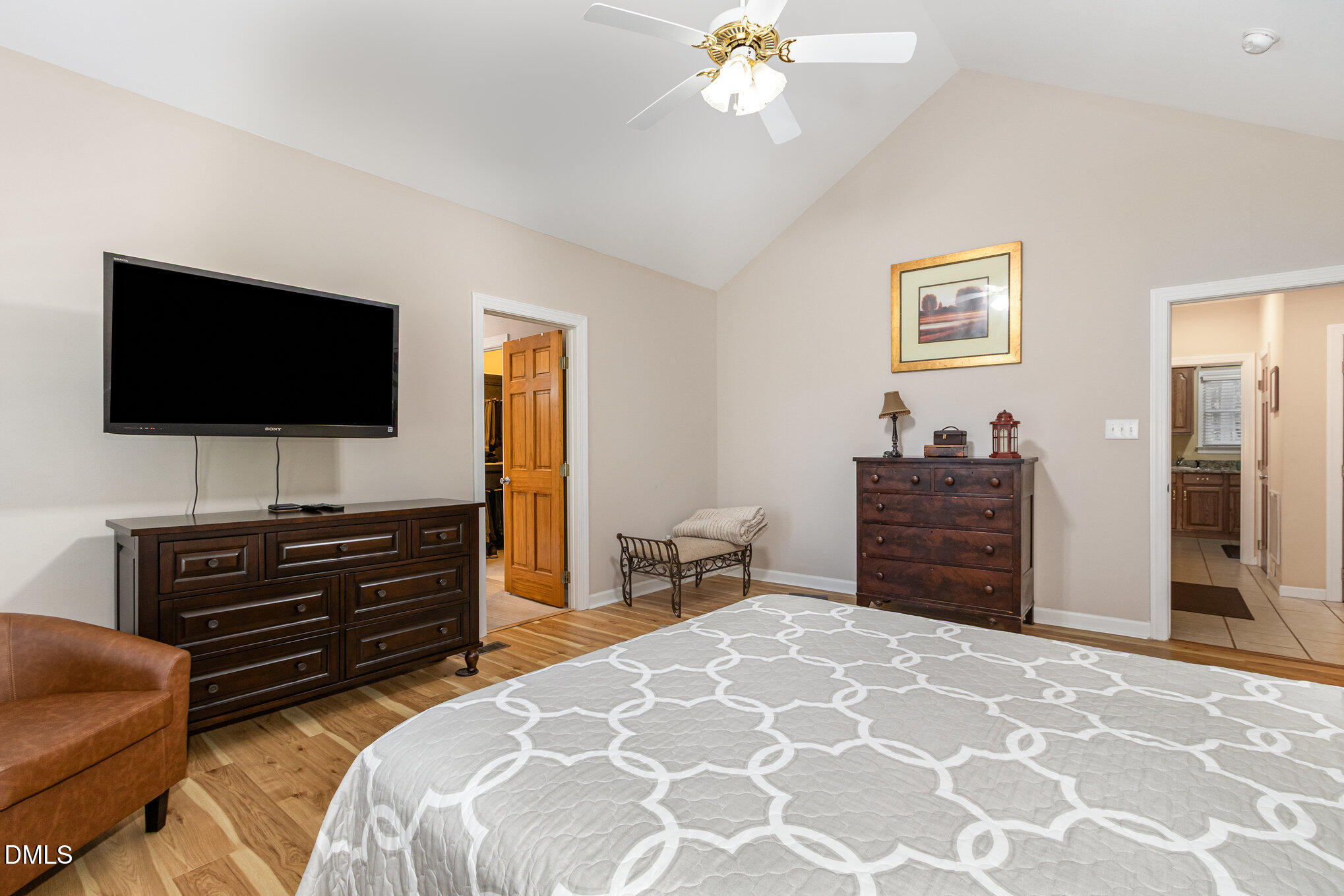 6018 West Tom Parham Road Oxford, NC 27565 - Photo 21 of 36 a bedroom with a bed and a flat screen tv