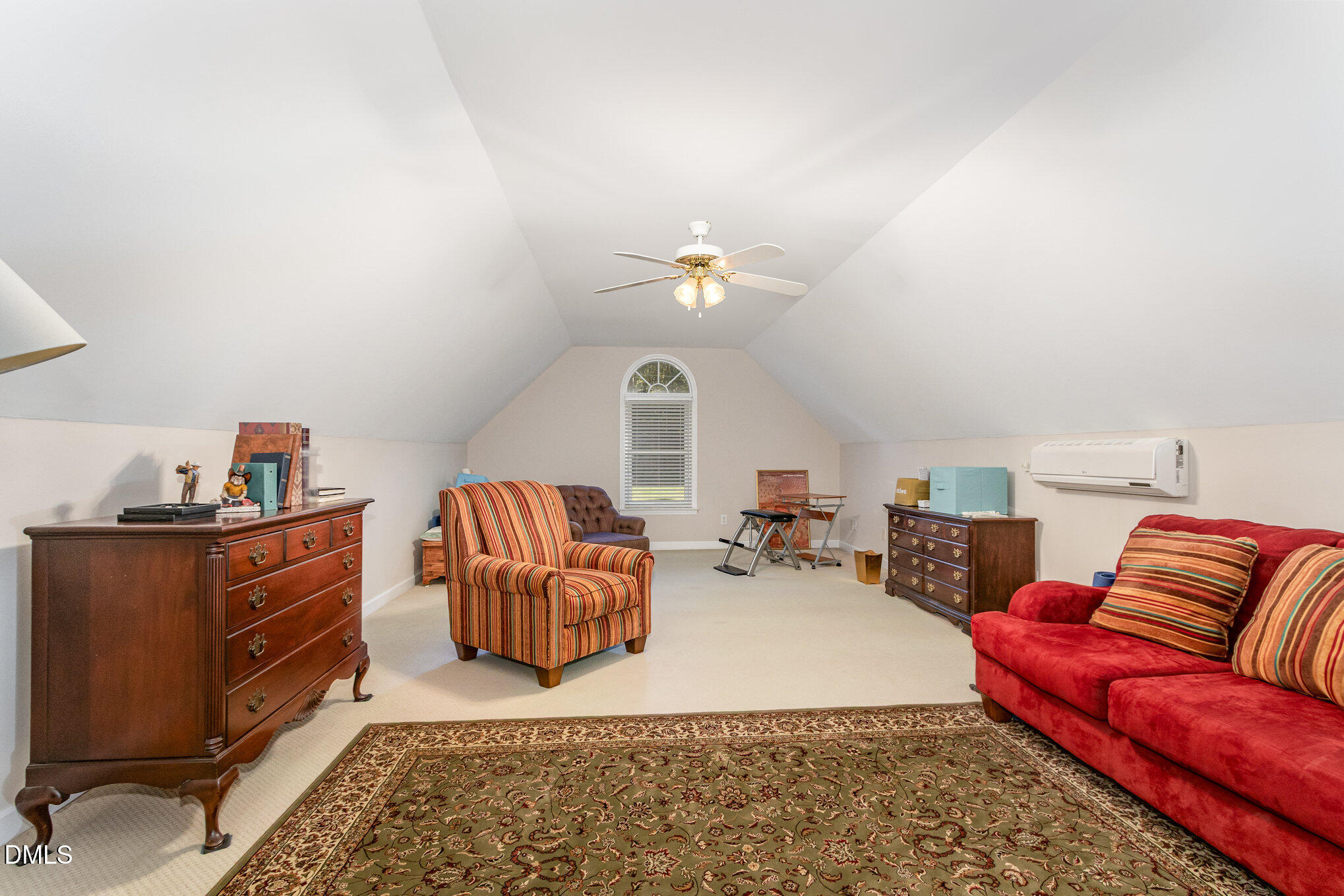 6018 West Tom Parham Road Oxford, NC 27565 - Photo 25 of 36 a living room with furniture a rug and a chandelier