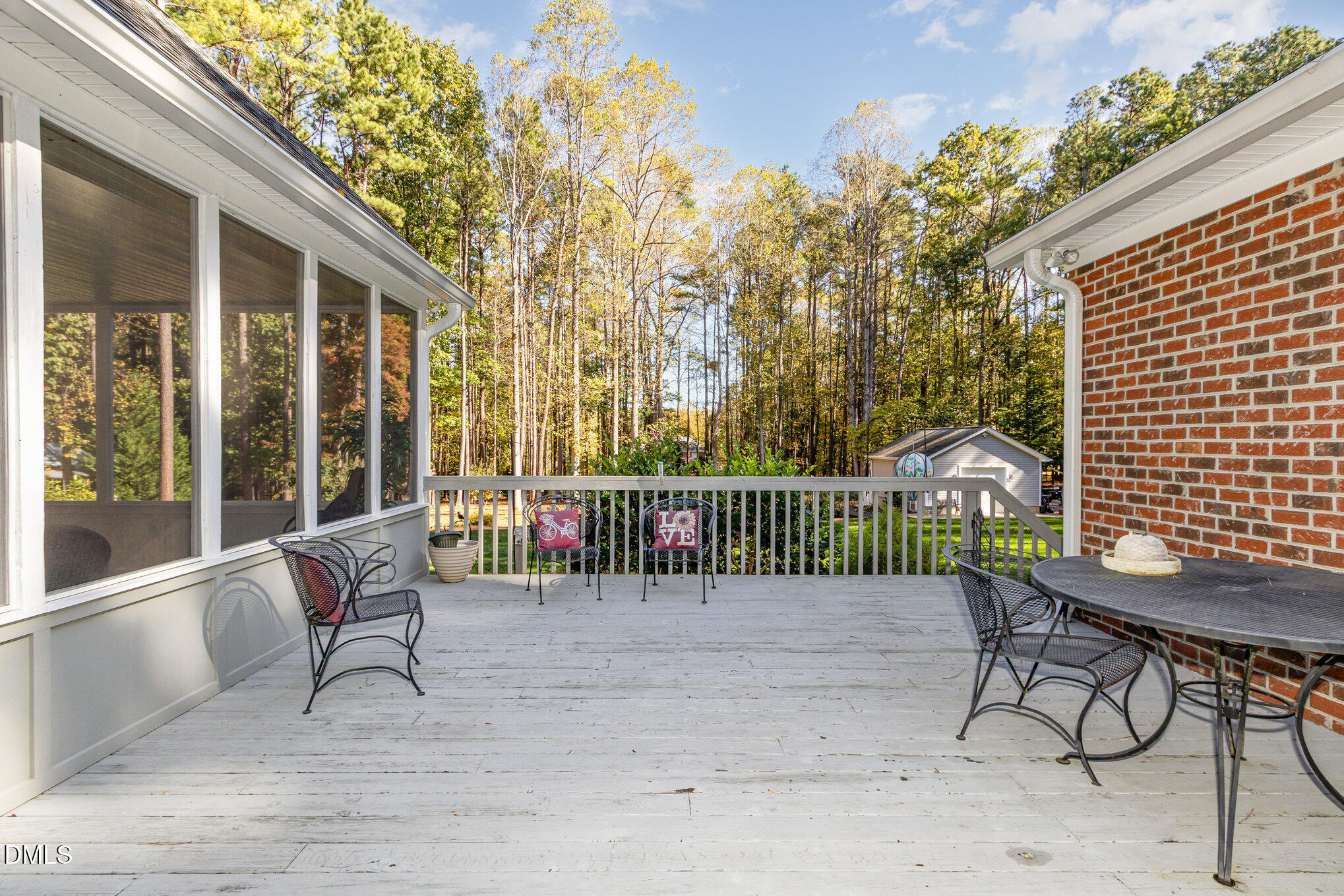 6018 West Tom Parham Road Oxford, NC 27565 - Photo 28 of 36 a view of a chair and table in the patio
