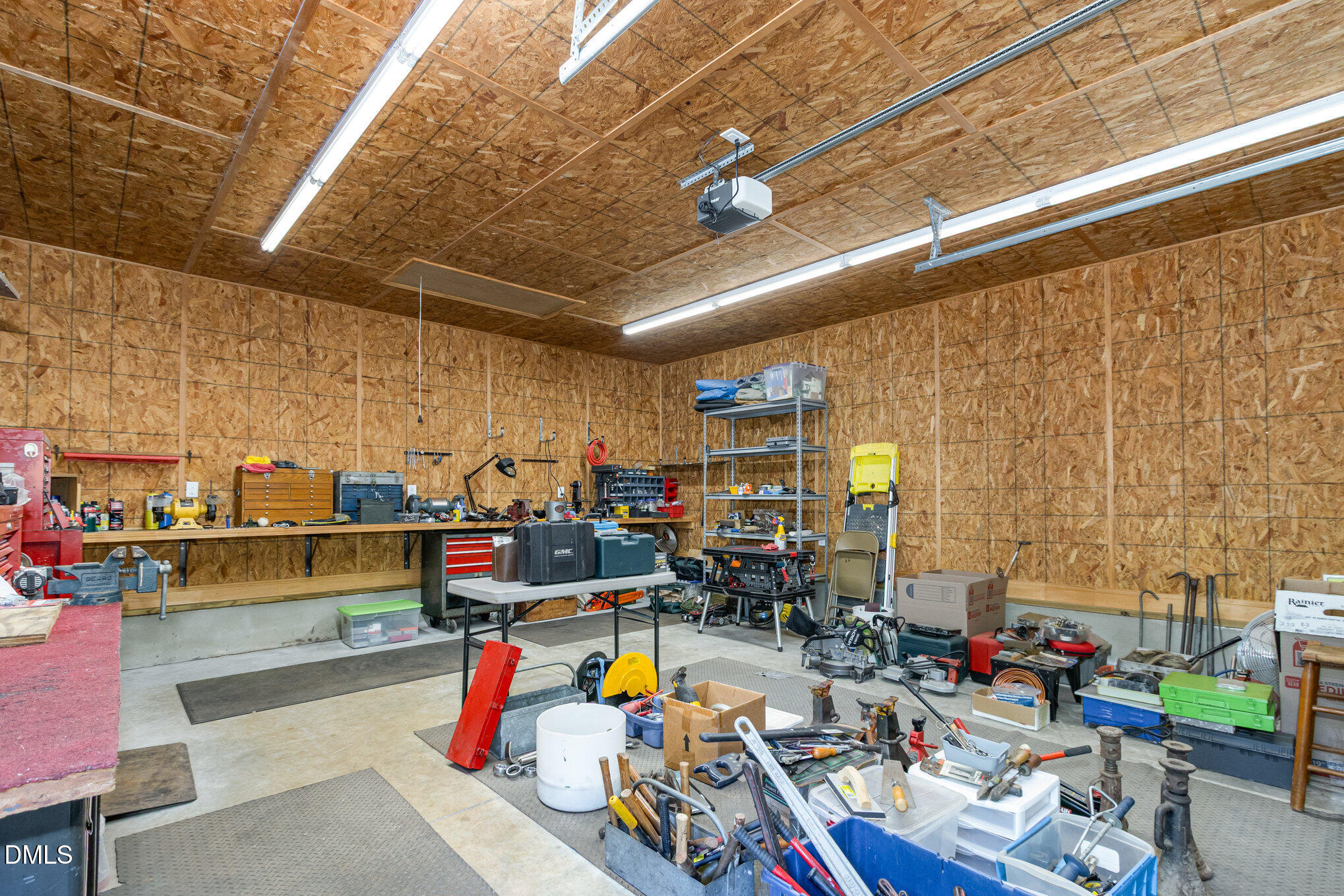 6018 West Tom Parham Road Oxford, NC 27565 - Photo 30 of 36 a storage room with lots of clutter and couches