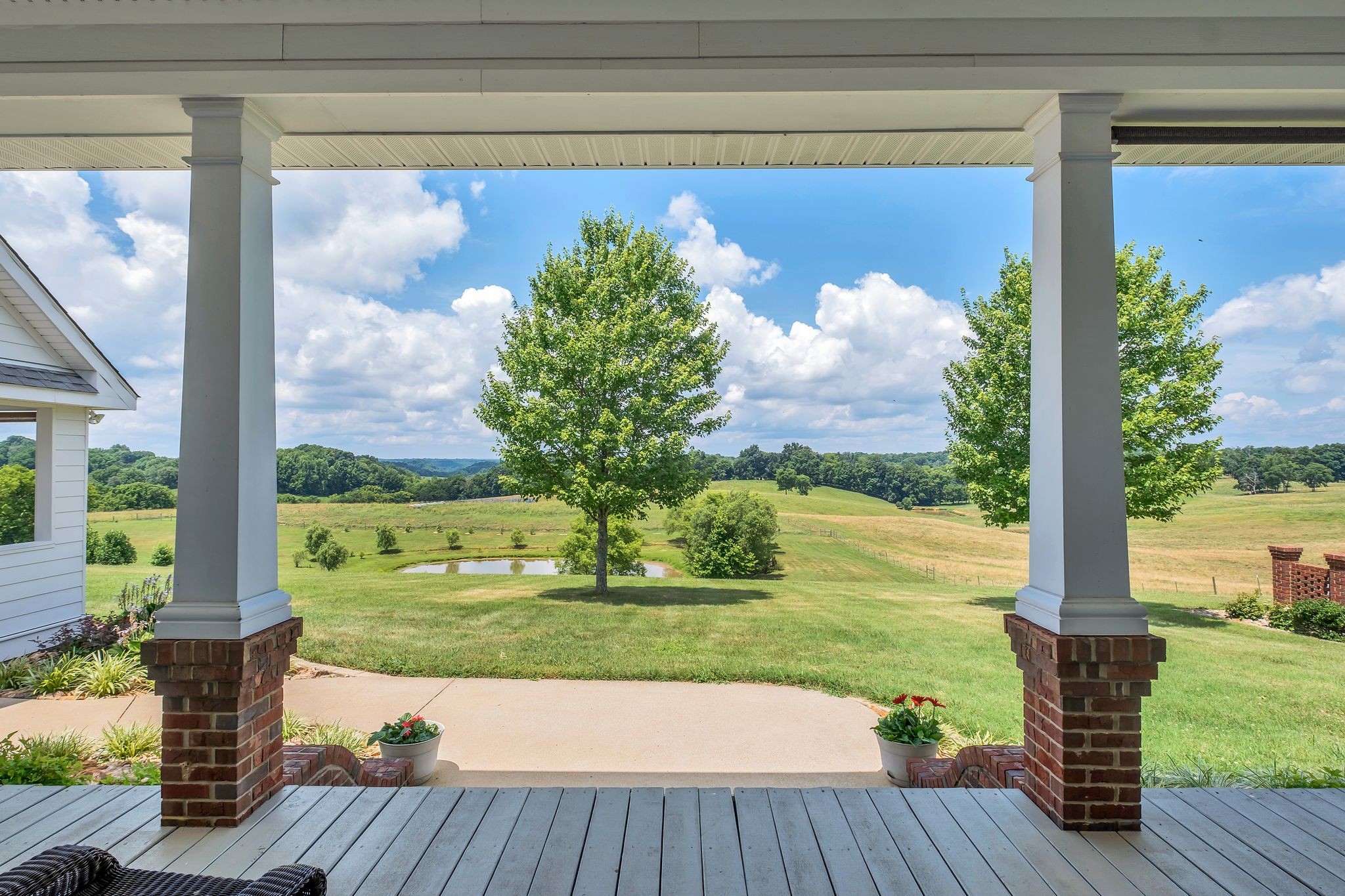 284 Firetower Road Pulaski, TN 38478 - Photo 8 of 58 a view of a porch with a table chairs and a yard