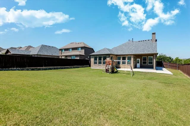 a view of a house with a big yard