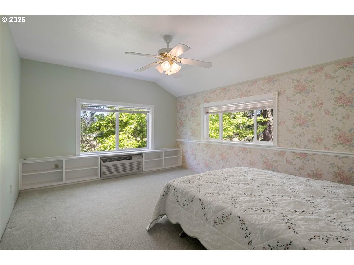 1300 Fair Oaks Road Oakland, OR 97462 - Photo 38 of 48 a bedroom with a bed and a chandelier