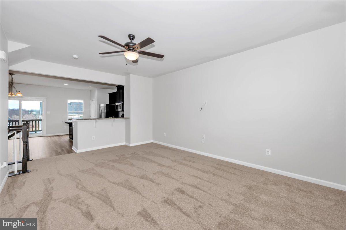 105 Montreal Way Falling Waters, WV 25419 - Photo 16 of 53 a view of a kitchen with a sink and a ceiling fan