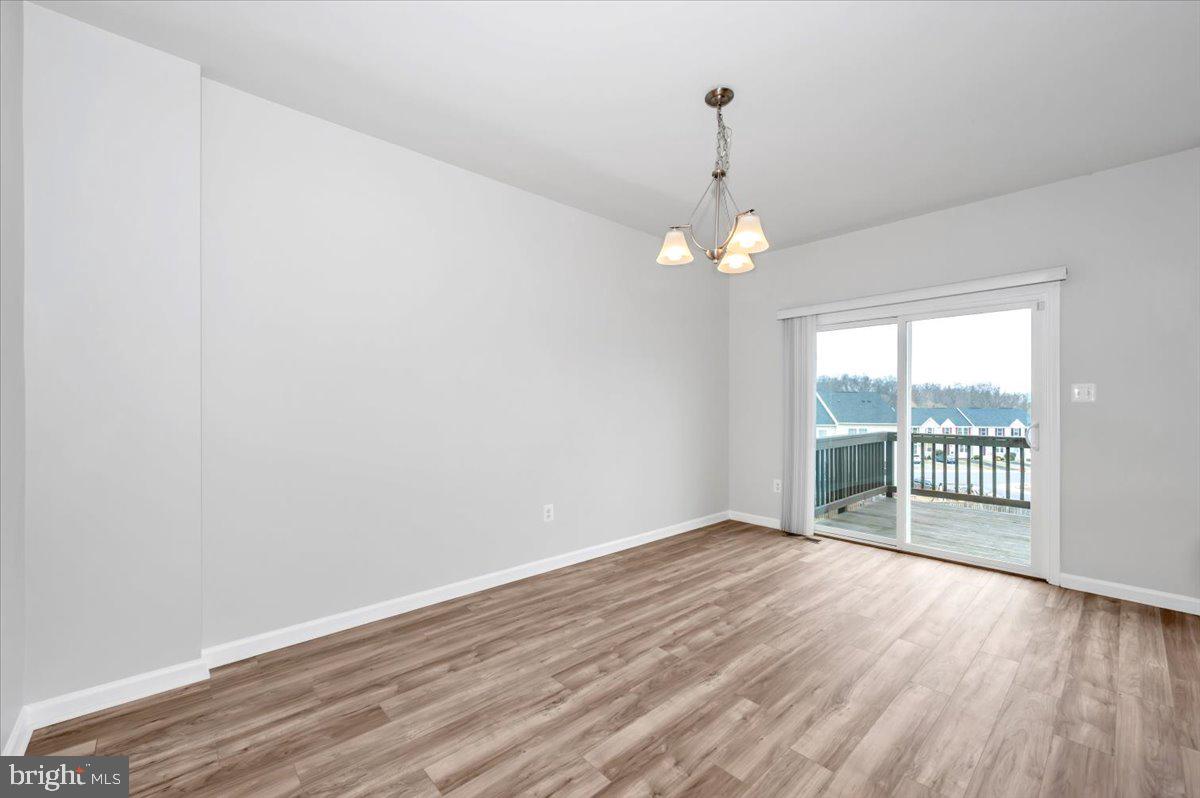 105 Montreal Way Falling Waters, WV 25419 - Photo 17 of 53 a view of a livingroom with wooden floor and a window