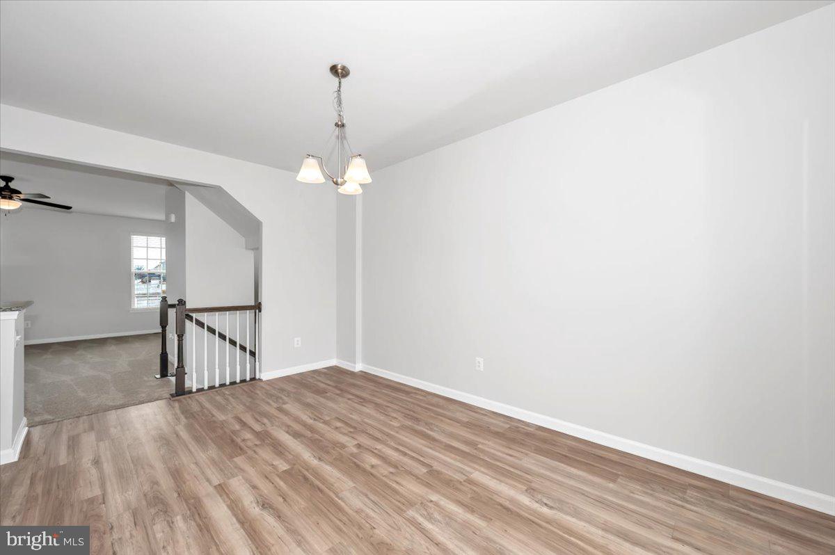 105 Montreal Way Falling Waters, WV 25419 - Photo 20 of 53 a view of a livingroom with a chandelier