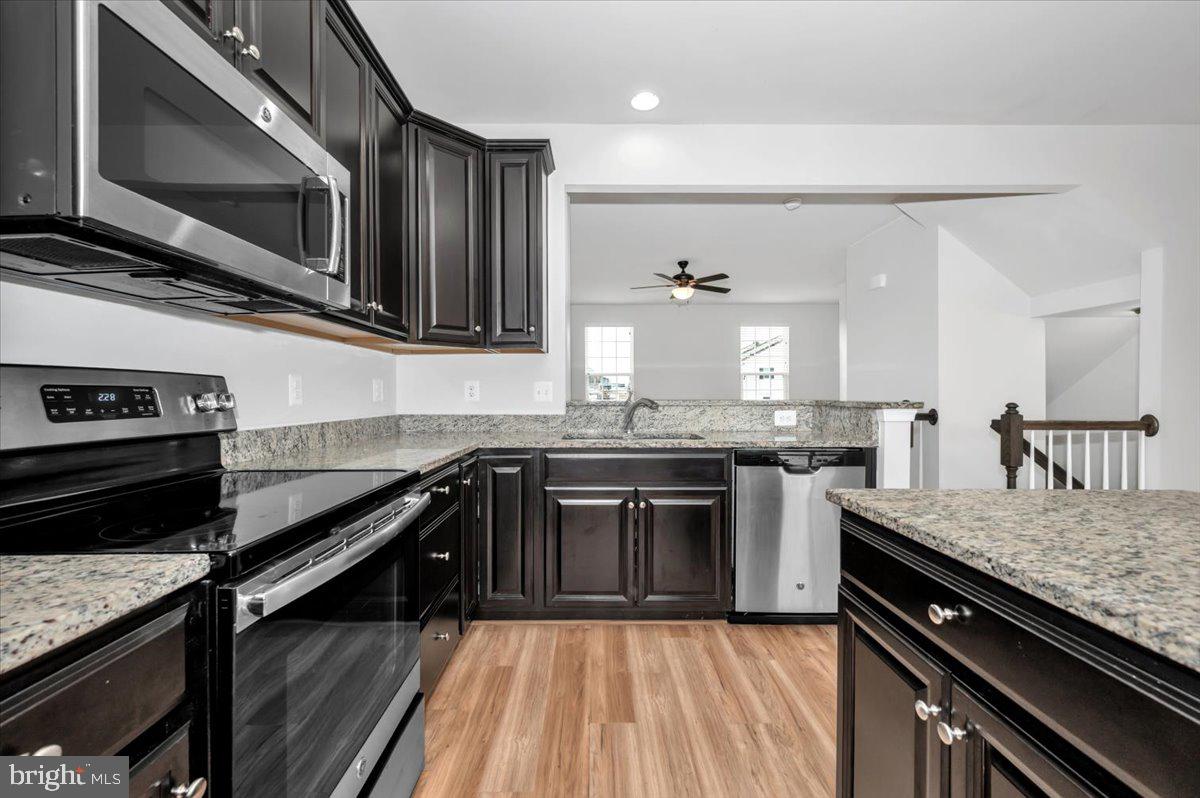 105 Montreal Way Falling Waters, WV 25419 - Photo 25 of 53 a kitchen with stainless steel appliances and cabinets