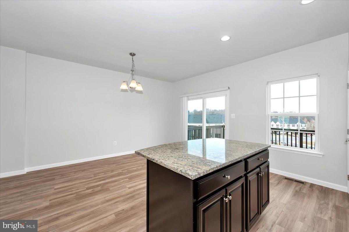105 Montreal Way Falling Waters, WV 25419 - Photo 27 of 53 an empty room with wooden floor and windows