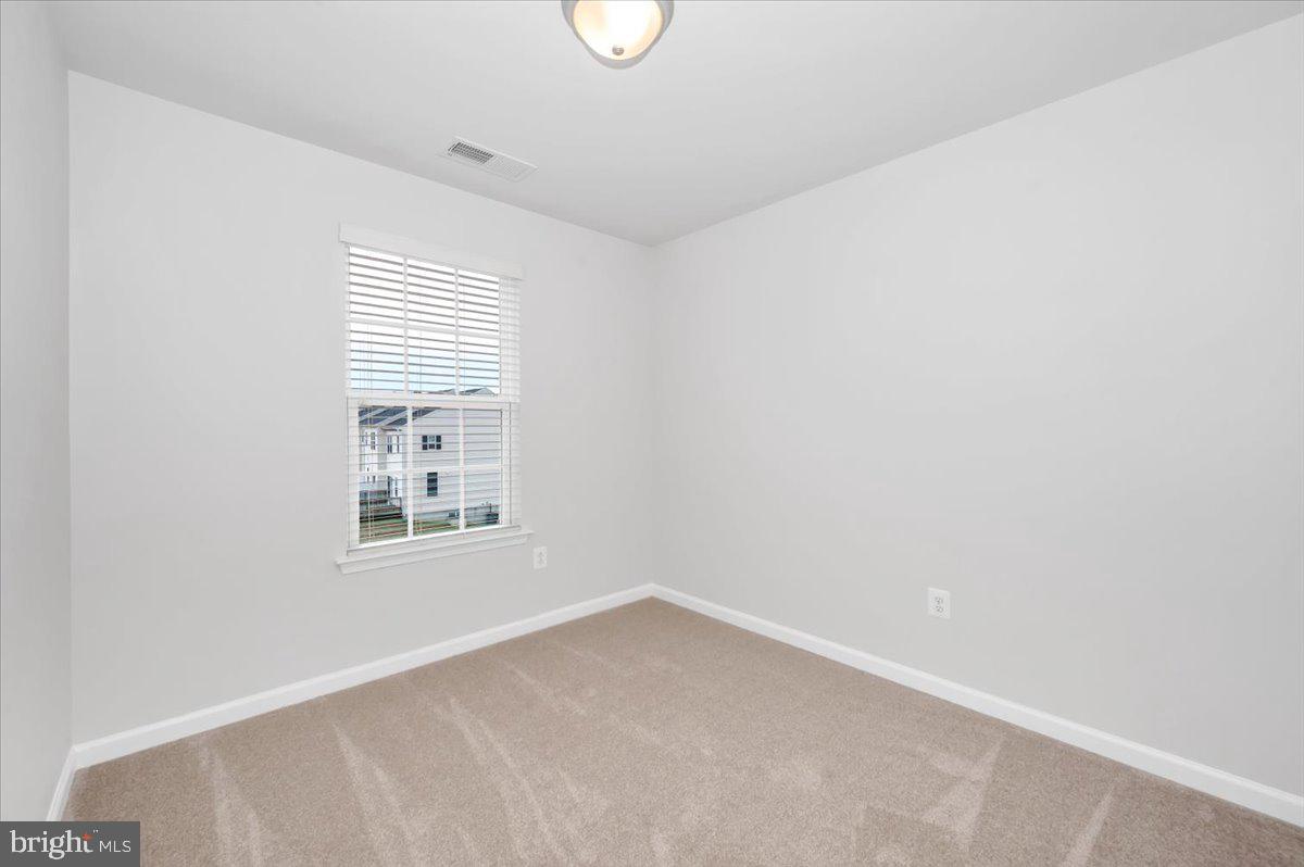 105 Montreal Way Falling Waters, WV 25419 - Photo 40 of 53 an empty room with windows