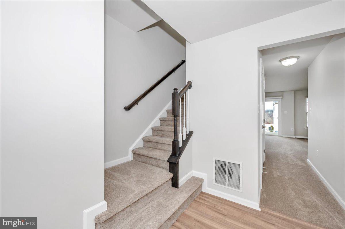 105 Montreal Way Falling Waters, WV 25419 - Photo 4 of 53 a view of entryway and hall with wooden floor