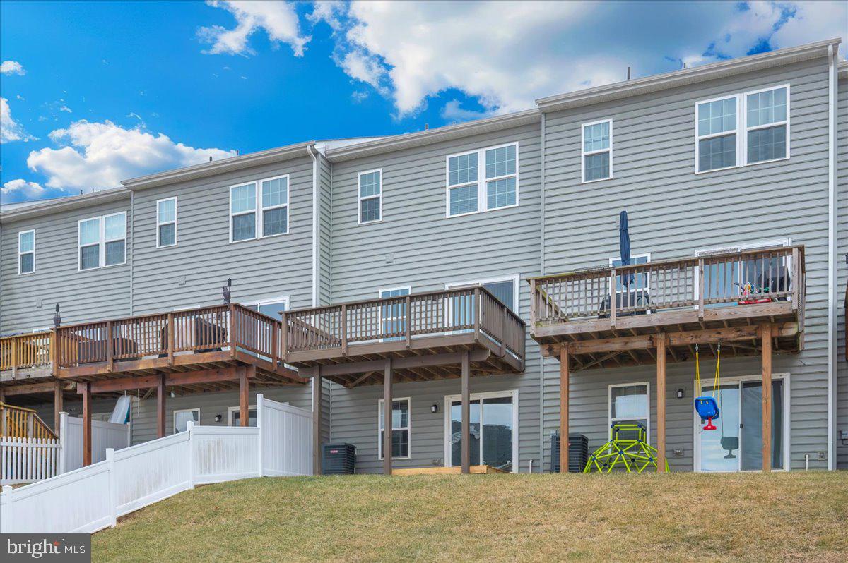 105 Montreal Way Falling Waters, WV 25419 - Photo 45 of 53 a view of a house with a garage and balcony