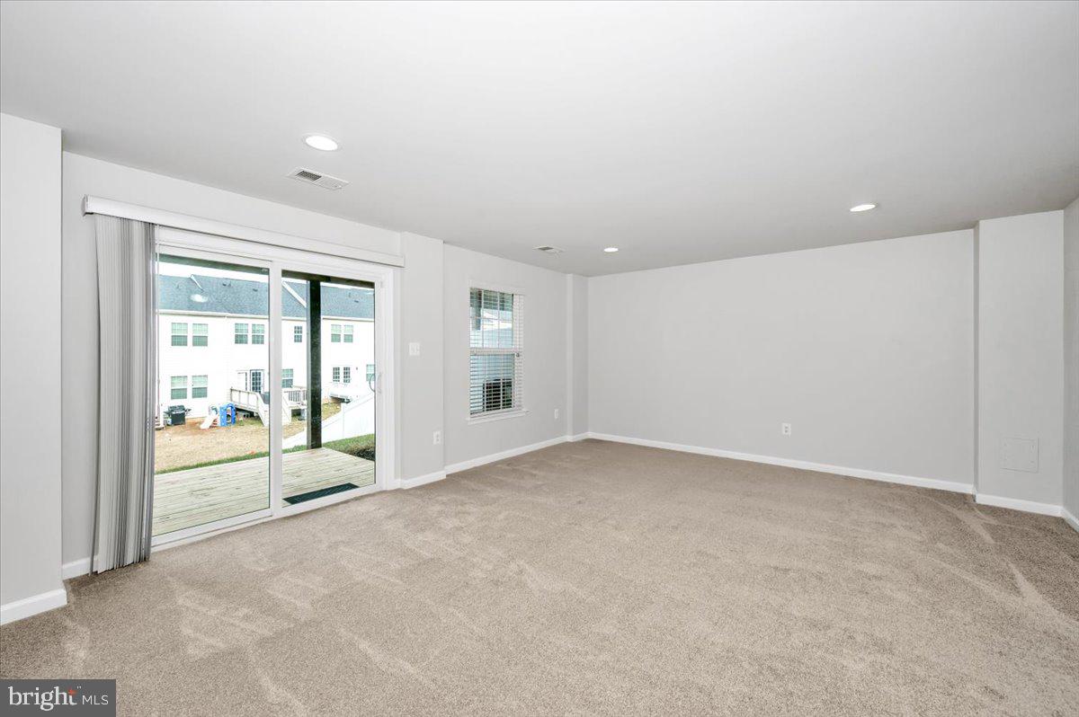 105 Montreal Way Falling Waters, WV 25419 - Photo 6 of 53 a view of an empty room with a window
