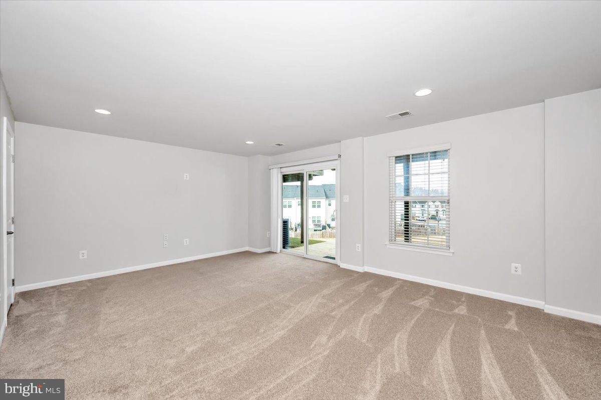 105 Montreal Way Falling Waters, WV 25419 - Photo 7 of 53 a view of an empty room with a window