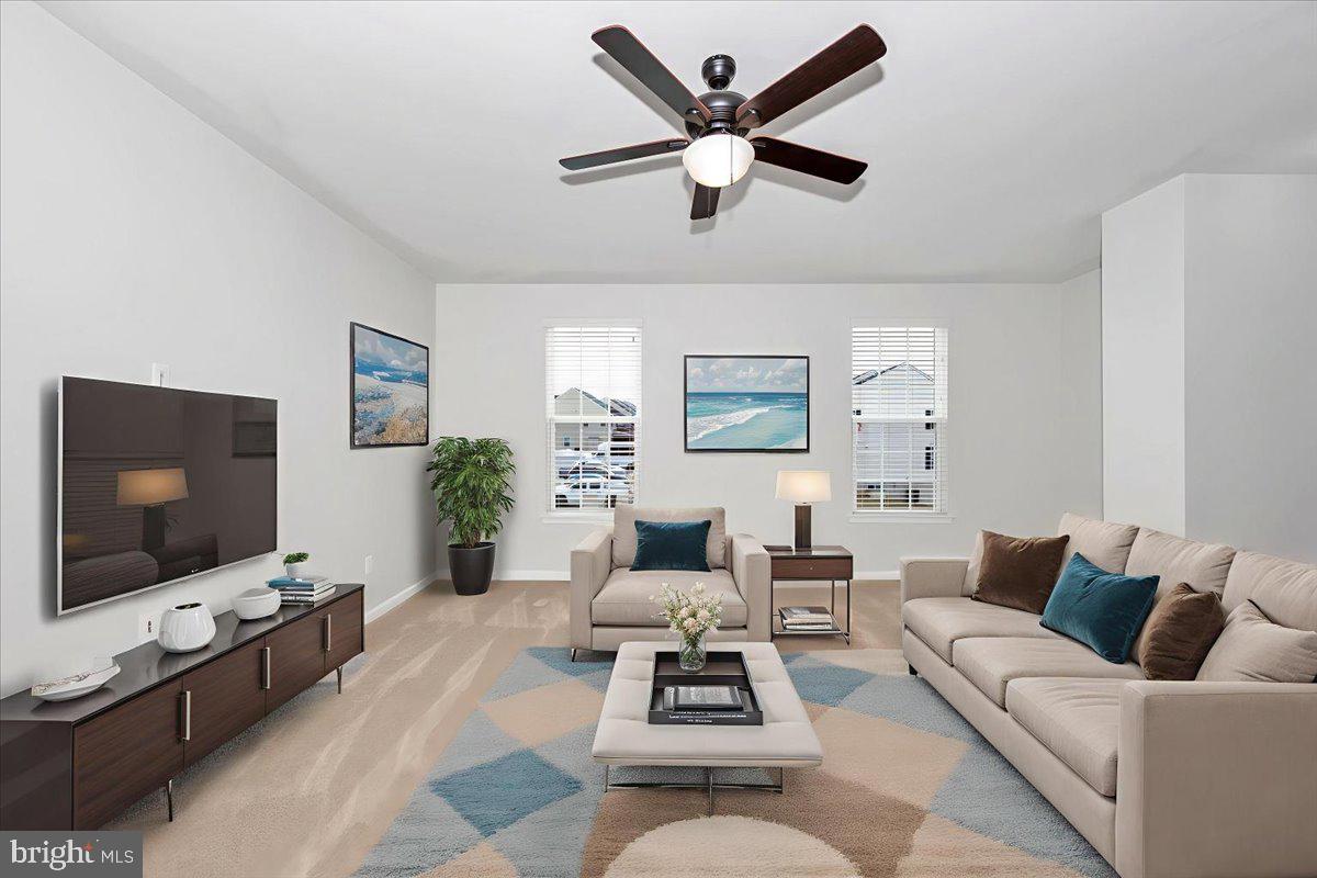 105 Montreal Way Falling Waters, WV 25419 - Photo 10 of 53 a living room with furniture and a flat screen tv