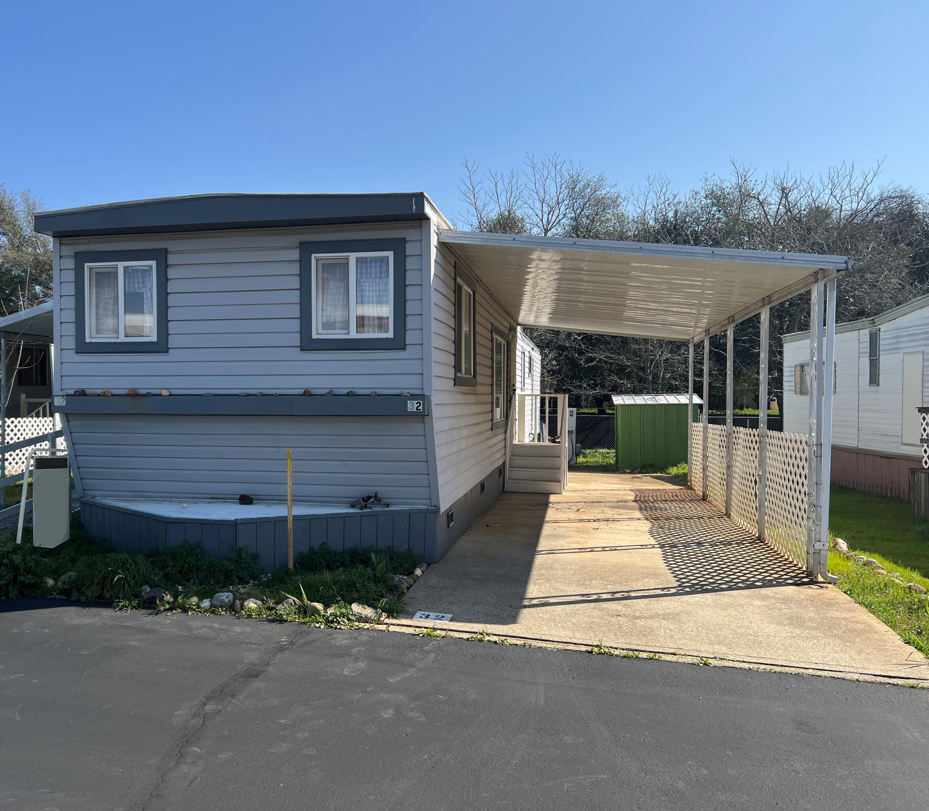 Undisclosed Address Redding, CA 96002 - Photo 1 of 7 a front view of a house with a garden