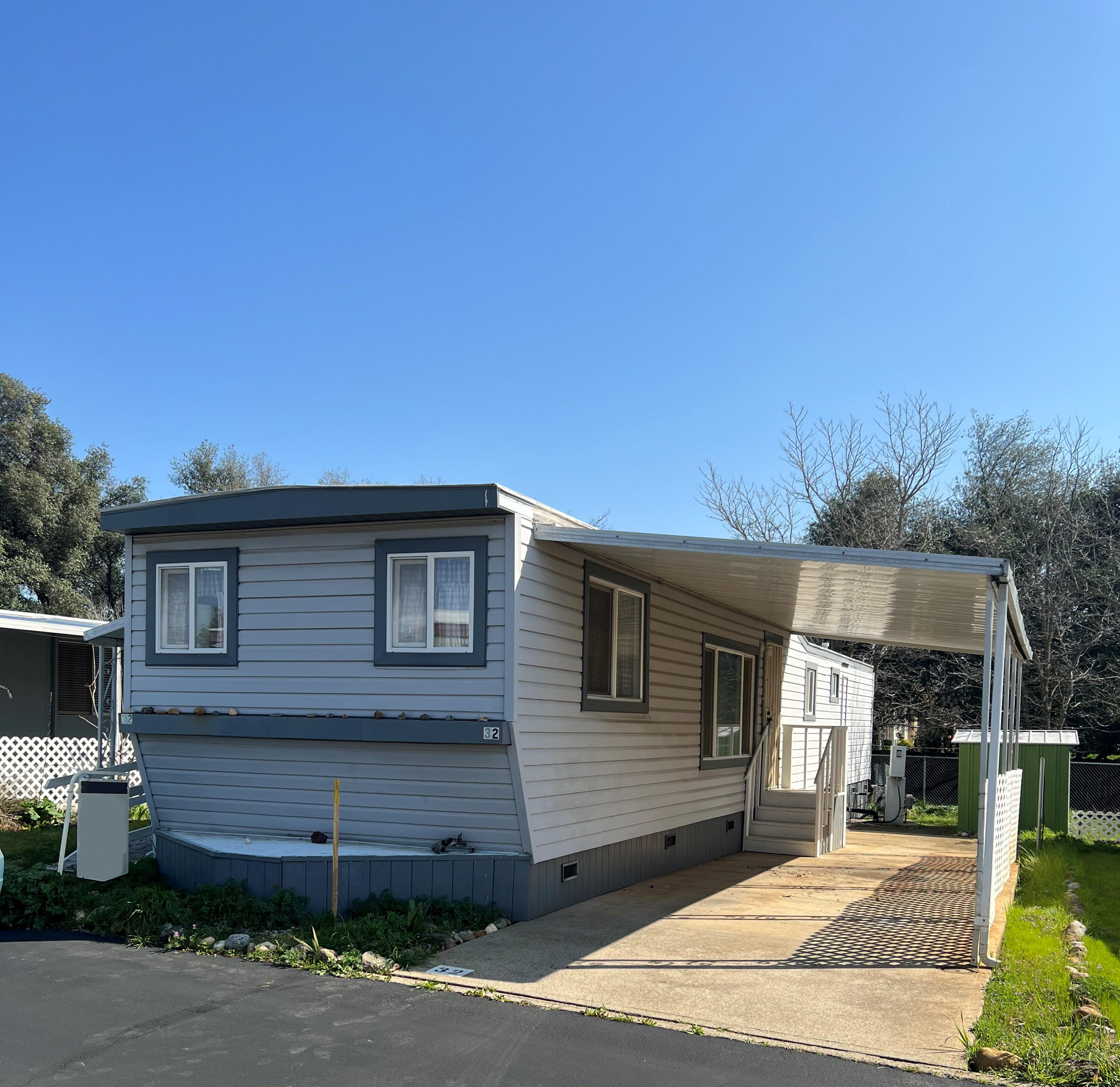 Undisclosed Address Redding, CA 96002 - Photo 2 of 7 a front view of a house with garden