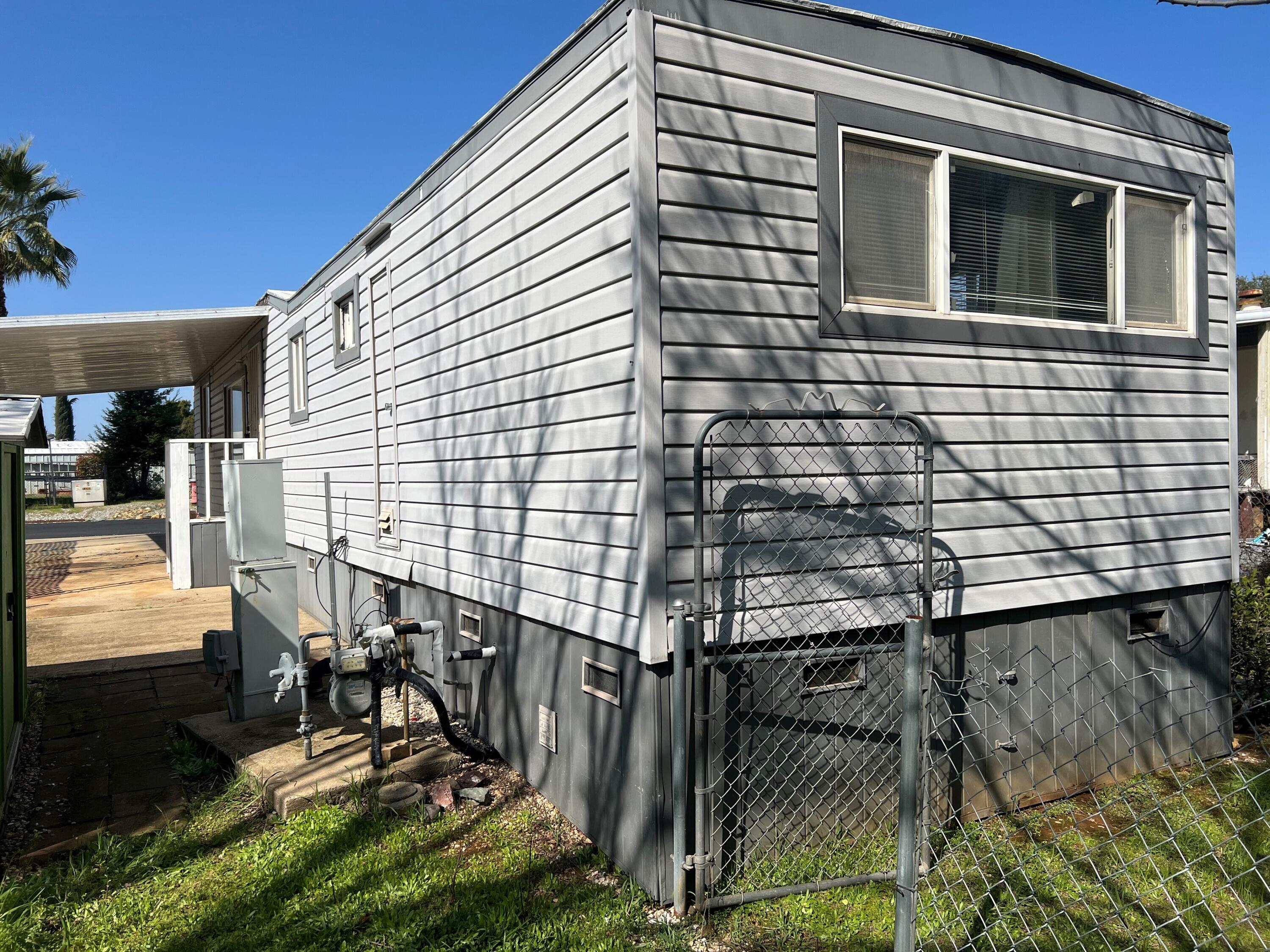 Undisclosed Address Redding, CA 96002 - Photo 5 of 7 a view of a house with backyard and sitting area