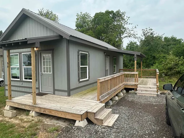 a house view with a backyard space