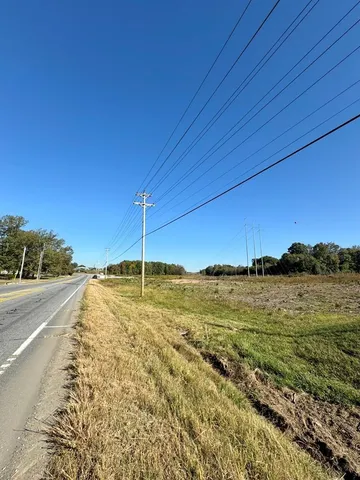 a view of a swimming pool with a table and chairs