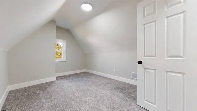 a view of a hallway with a window