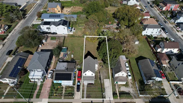 an aerial view of houses with street