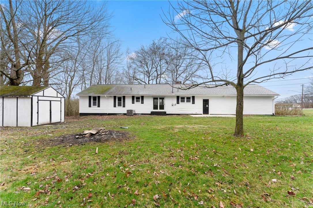 1707 Brookfield Road Hubbard, OH 44425 - Photo 25 of 30 View of front of house featuring a front yard and a storage shed