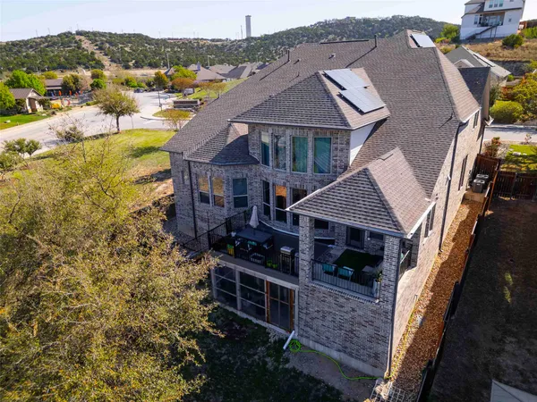 a aerial view of a house with a yard