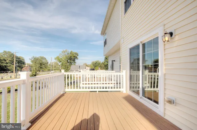a view of a balcony with wooden floor