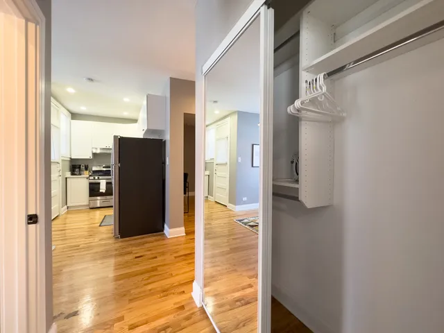 a view of a living room with a refrigerator
