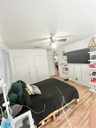 a bedroom with a bed and window