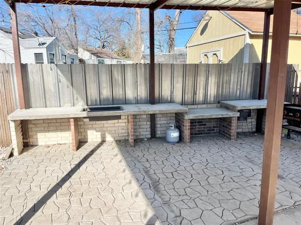 a view of a chairs and table in the patio