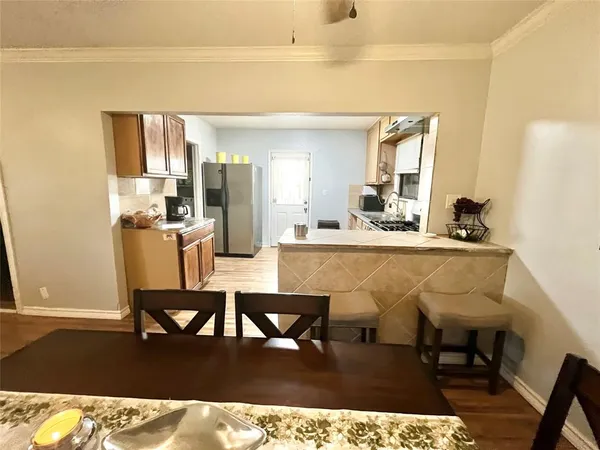 a living room with a table and chairs