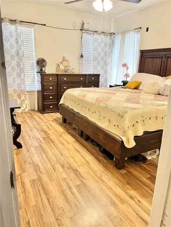 a bedroom with a bed and a dresser