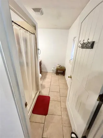 a bath room with a toilet and a shower