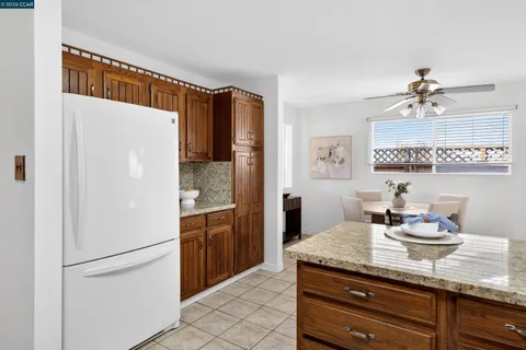 a kitchen with stainless steel appliances a refrigerator and cabinets