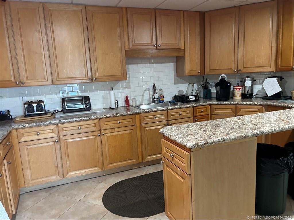 1997 Southwest Palm City Road, Unit 48H Stuart, FL 34994 - Photo 41 of 49 Kitchen at clubhouse