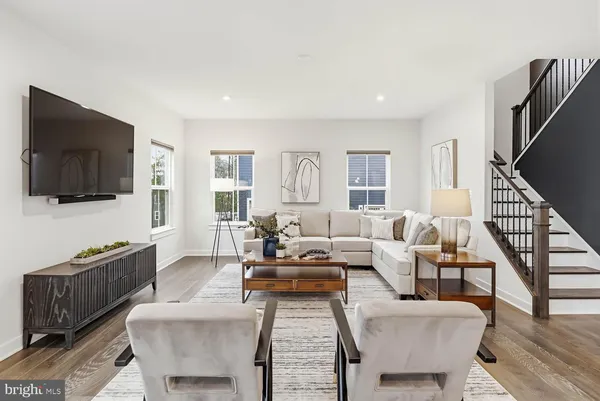 a large kitchen with a table and chairs