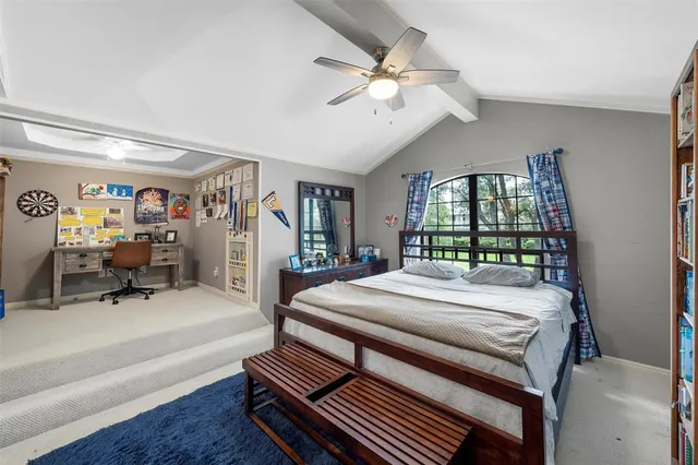 a bed room with a bed and a large mirror