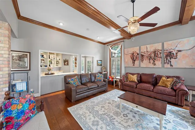 a living room with furniture flat screen tv and a couch