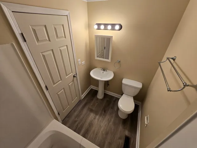 a bathroom with a toilet and a sink